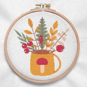 présentation toile point de croix bouquet d'automne dans une tasse