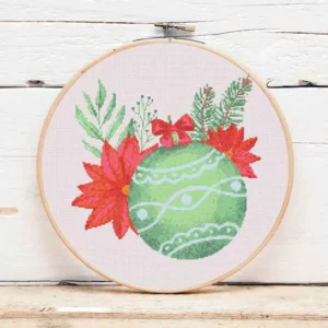 présentation toile point de croix Boule de noël avec poinsettia